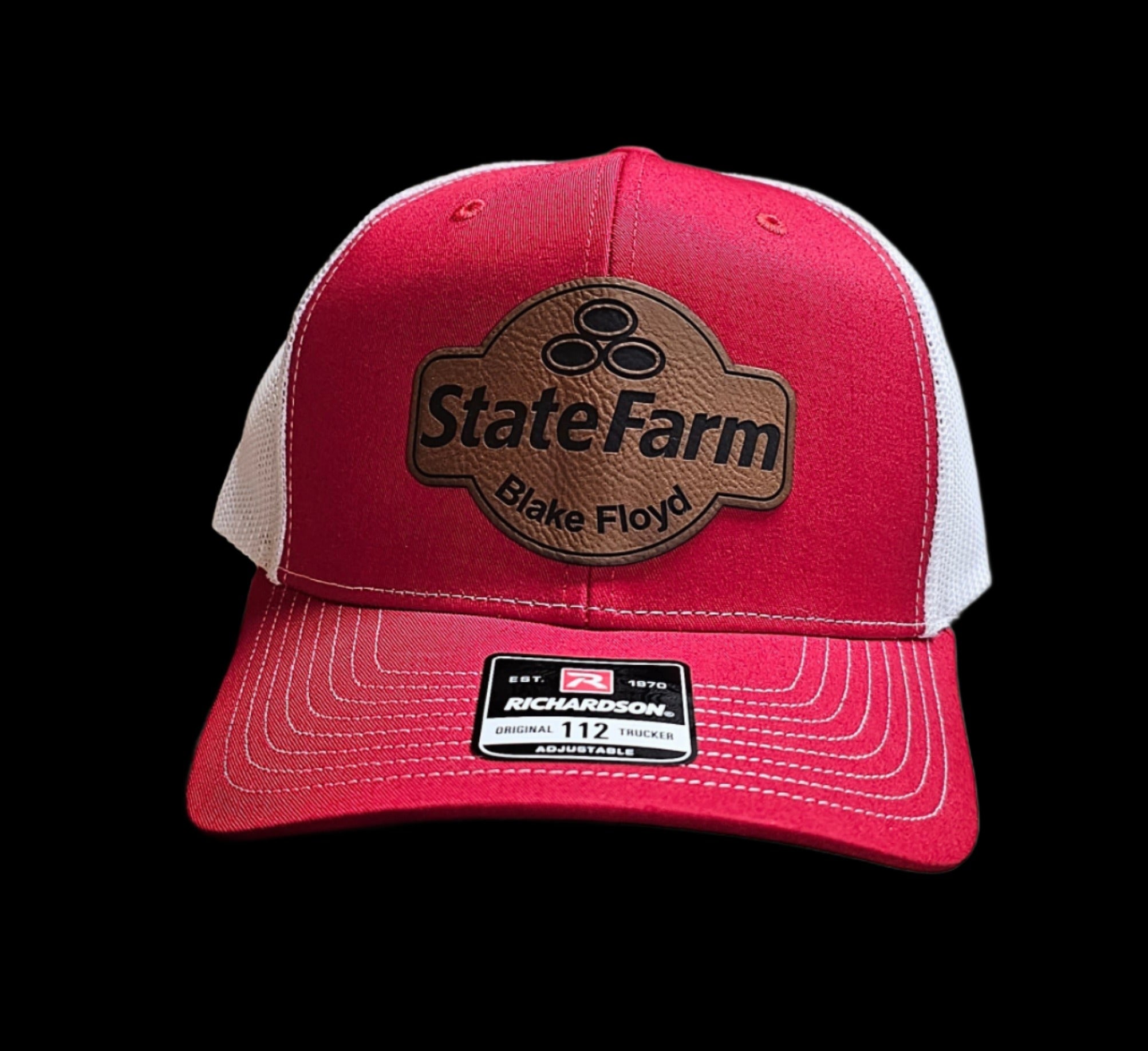 custom patch on red and white cap