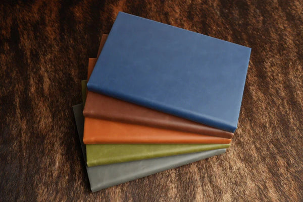 stack of leatherette journals