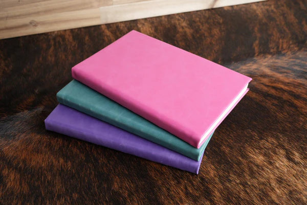 stack of leatherette journals