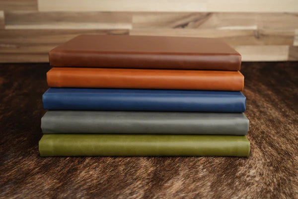 stack of leatherette journals
